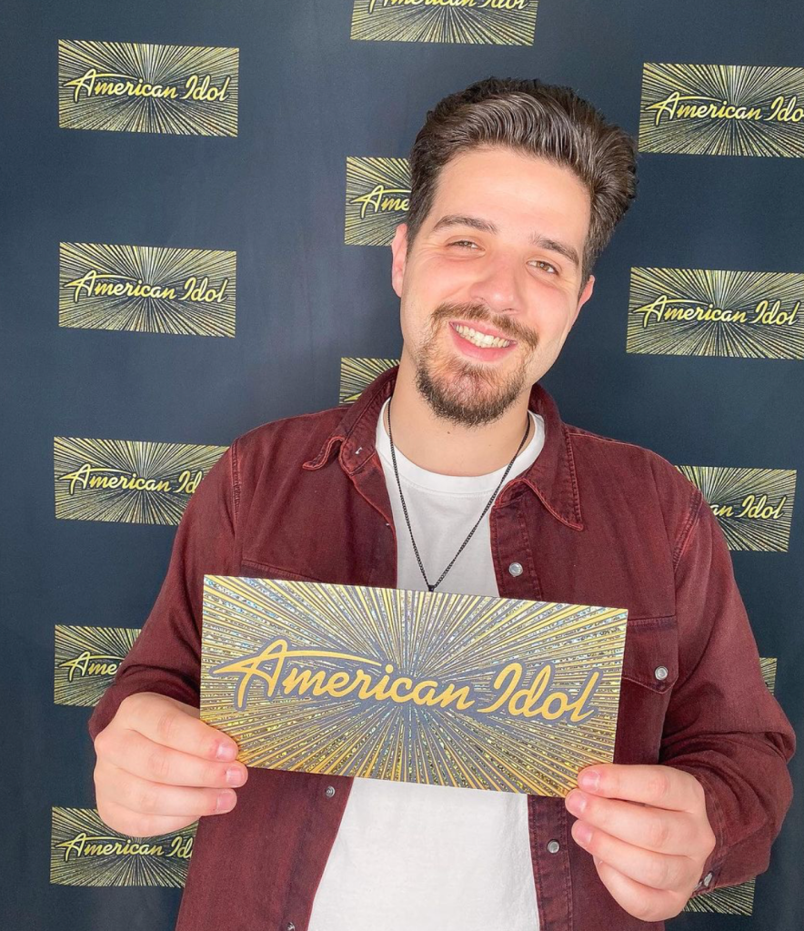 Noah Peters holding a ticket to American Idol in Hollywood